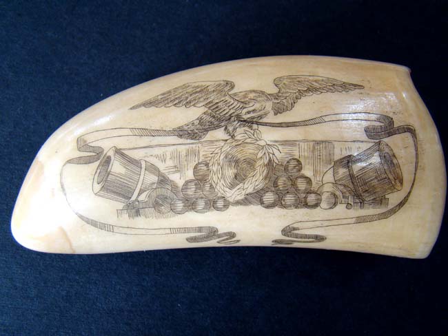 A Civil War era scrimshawed Whale's Tooth depicting the CSS 'Nashville' capturing and burning the 'Harvey Birch' circa 1861.